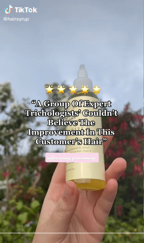 Hand holds up hair syrup bottle with a customer quote overlaid on top