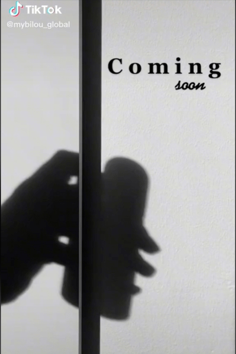Shadow of a hand holding a shower foam bottle and the words "Coming Soon"